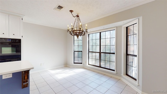 unfurnished dining area with a notable chandelier, ornamental molding, a textured ceiling, and light tile patterned floors