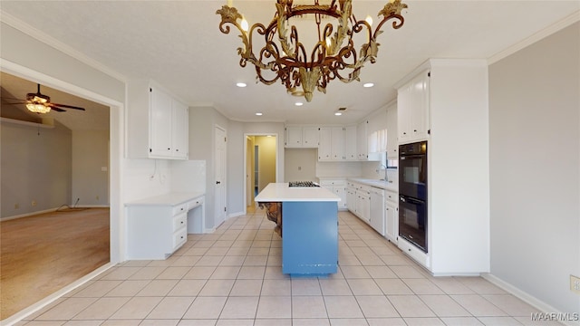 kitchen with white cabinetry, crown molding, a kitchen island, and light tile patterned floors