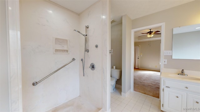 bathroom featuring ceiling fan, vanity, tile patterned floors, toilet, and walk in shower