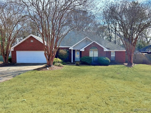 ranch-style house with a garage and a front lawn