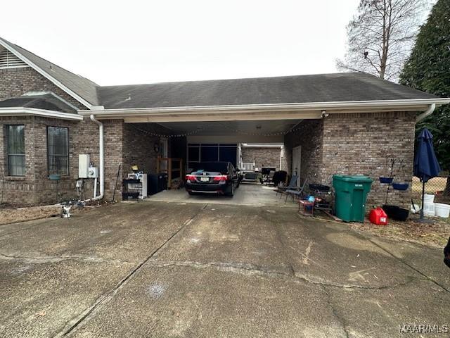 view of vehicle parking featuring a carport