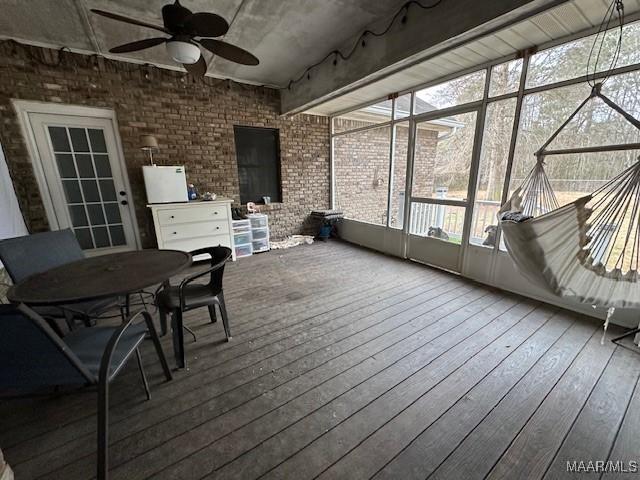 sunroom / solarium with ceiling fan