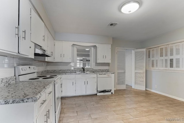 kitchen with white cabinetry, white appliances, sink, and decorative backsplash