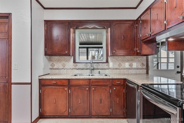 kitchen featuring tasteful backsplash, sink, and a wealth of natural light