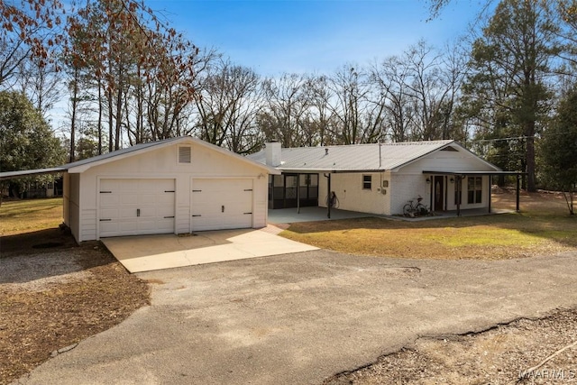 ranch-style home with a garage and a front yard