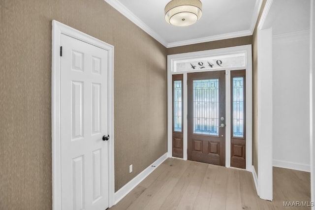 entryway featuring ornamental molding and light hardwood / wood-style floors