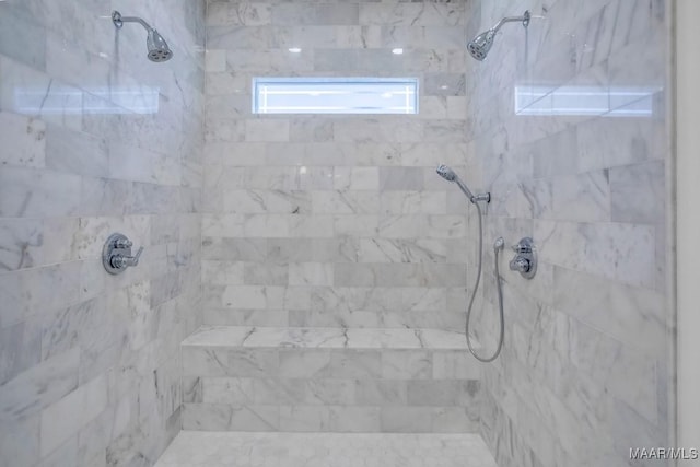 bathroom with tiled shower