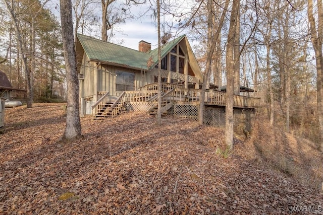 rear view of property with a deck