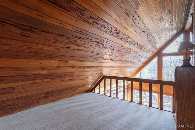 bonus room featuring lofted ceiling, a wealth of natural light, wooden walls, and wooden ceiling