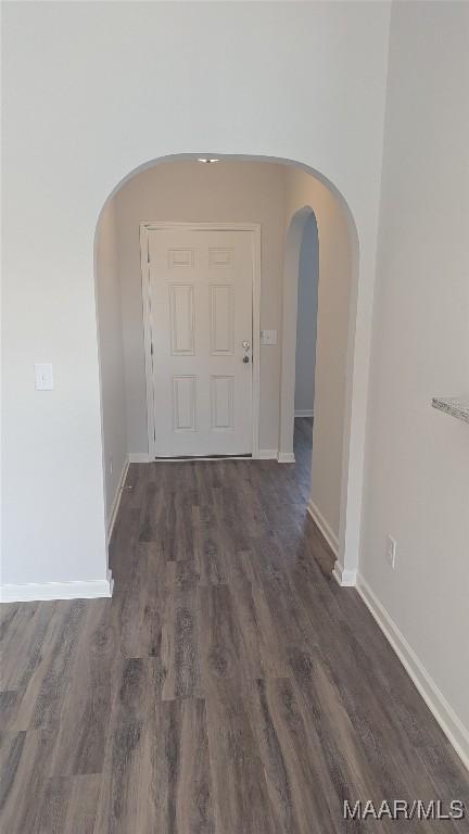 corridor featuring dark hardwood / wood-style floors