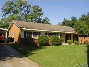 ranch-style house with a front yard