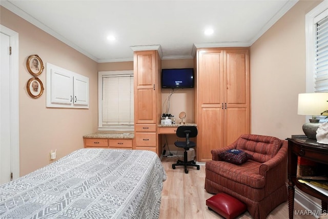 bedroom featuring ornamental molding and light hardwood / wood-style flooring