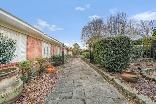 view of side of home with a patio area