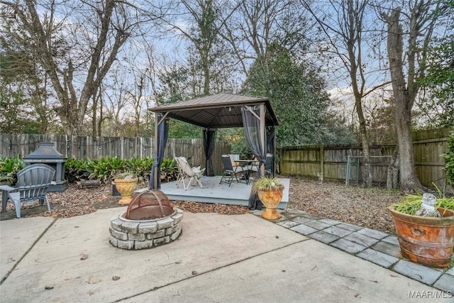 view of patio featuring a gazebo and an outdoor fire pit