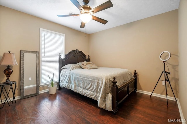 bedroom featuring dark wood-type flooring and ceiling fan