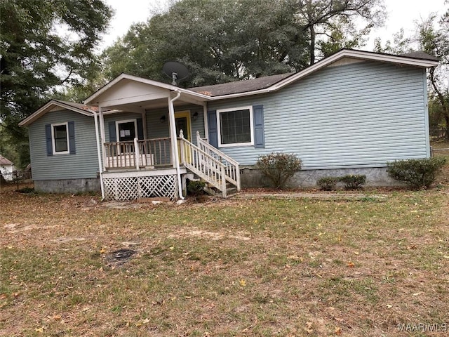 ranch-style home with a porch and a front yard