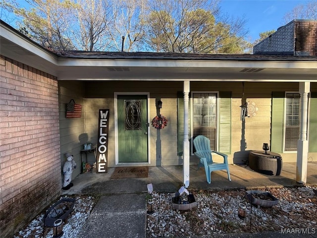 entrance to property featuring a patio area