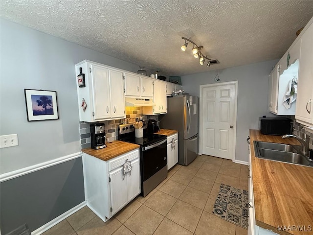 kitchen with backsplash, appliances with stainless steel finishes, sink, and white cabinets