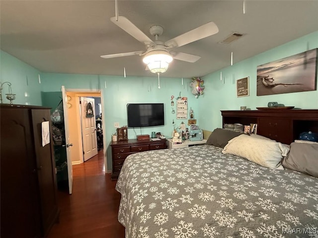 bedroom featuring dark hardwood / wood-style flooring and ceiling fan