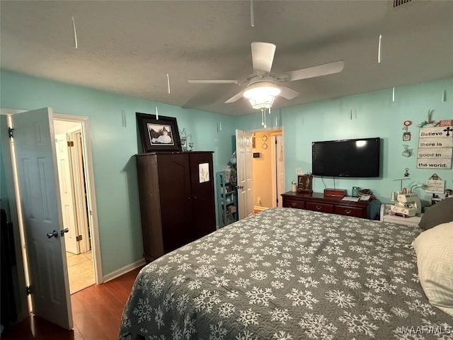 bedroom featuring wood-type flooring and ceiling fan