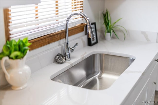 room details with sink and white cabinets