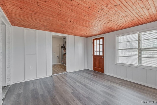 interior space featuring hardwood / wood-style flooring and wooden ceiling