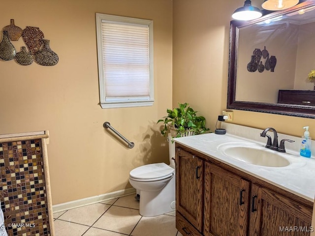 bathroom with tile patterned floors, toilet, and vanity