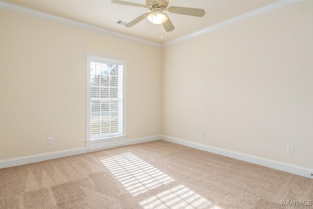 carpeted empty room with ornamental molding and ceiling fan