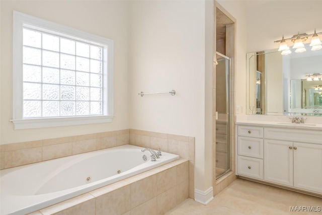 bathroom with vanity, shower with separate bathtub, and tile patterned flooring