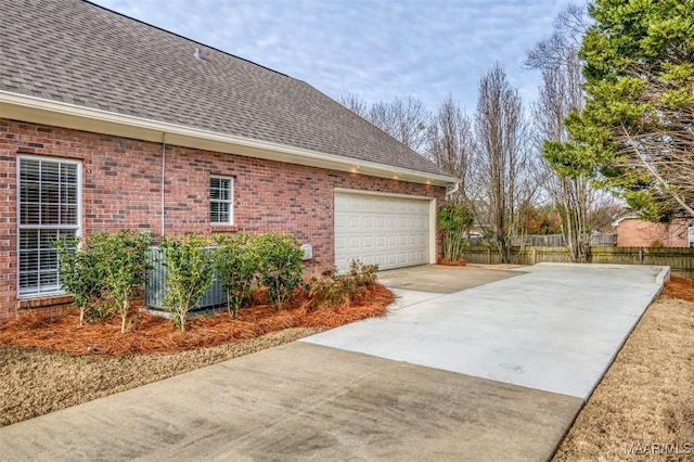 view of side of home with a garage