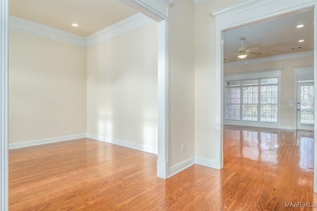 unfurnished room featuring ceiling fan, ornamental molding, and light hardwood / wood-style flooring