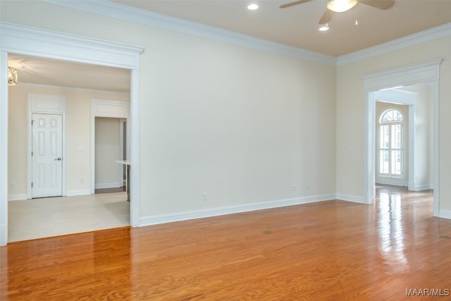 unfurnished room featuring ornamental molding, ceiling fan, and light hardwood / wood-style floors