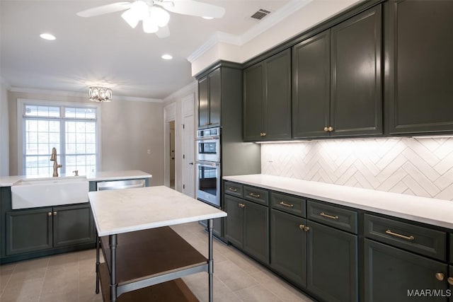 kitchen featuring sink, crown molding, stainless steel appliances, light tile patterned flooring, and decorative backsplash