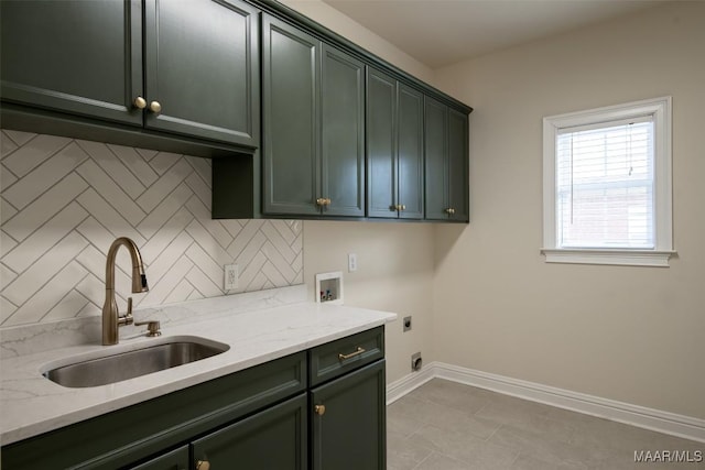 laundry room featuring washer hookup, sink, cabinets, and hookup for an electric dryer