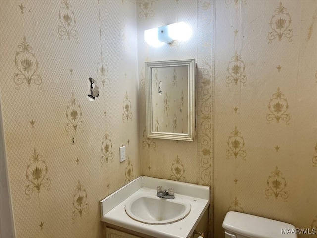 bathroom with vanity and toilet