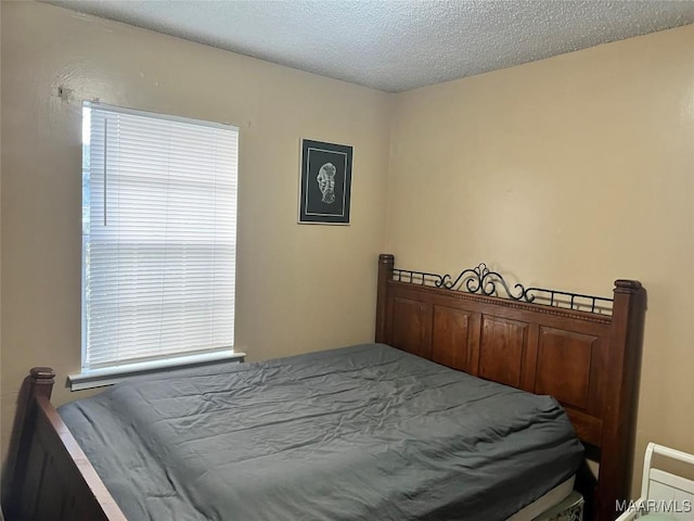 bedroom featuring a textured ceiling