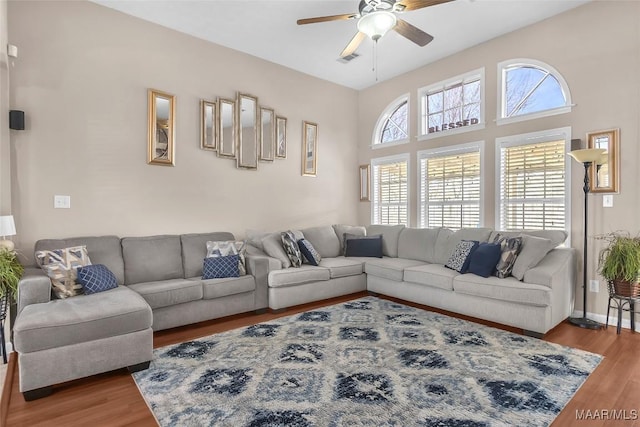 living room with hardwood / wood-style floors and ceiling fan