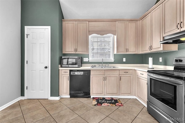 kitchen with light brown cabinetry, sink, stainless steel appliances, and light tile patterned flooring