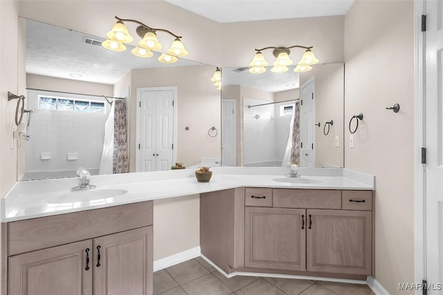 bathroom featuring a shower with curtain, tile patterned floors, and vanity