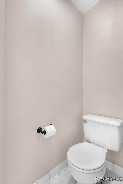 bathroom featuring tile patterned flooring and toilet