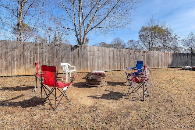 view of yard with a fire pit