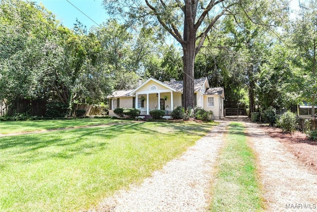 view of front of property with covered porch and a front lawn