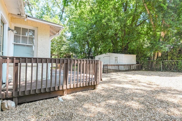 wooden deck featuring a shed