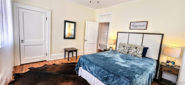 bedroom featuring wood-type flooring