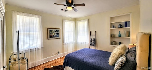 bedroom with wood-type flooring and ceiling fan