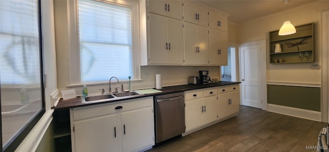 kitchen with white cabinetry, decorative light fixtures, dishwasher, and sink