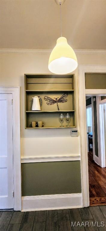 room details with crown molding and hardwood / wood-style flooring