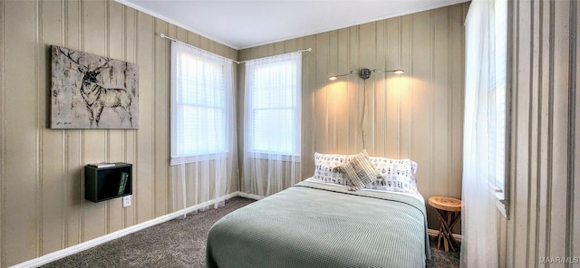 bedroom with multiple windows and carpet flooring