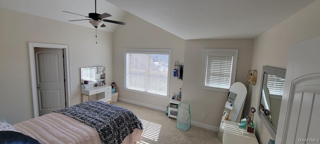 bedroom featuring lofted ceiling, light carpet, and ceiling fan