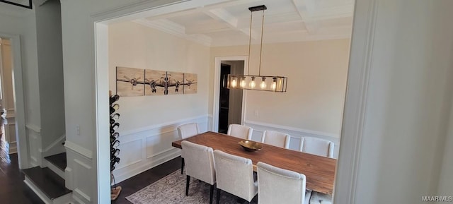 dining room featuring coffered ceiling, dark wood-type flooring, and beam ceiling